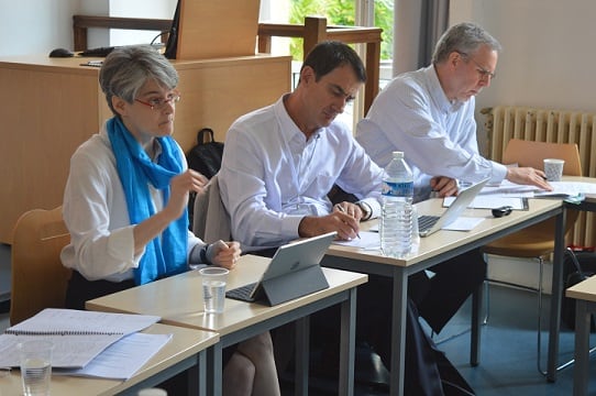 Emily Kadens, Benito Arrunada, and Scott Masten at the conference.